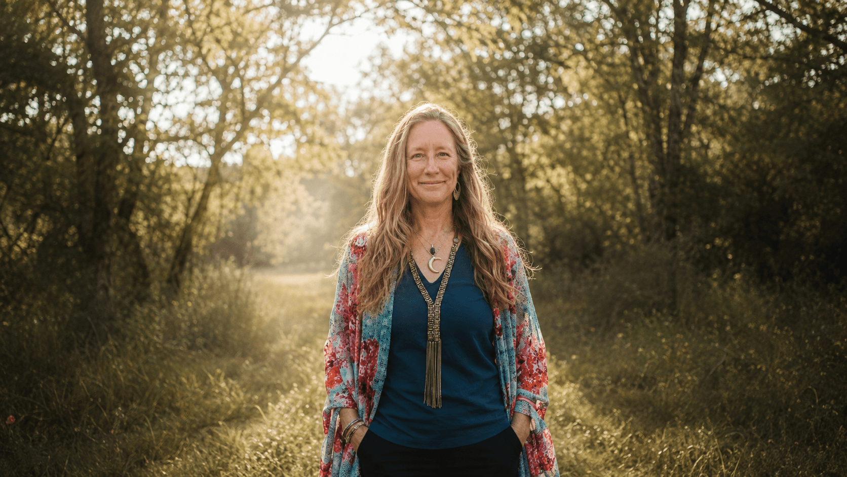Heather standing in a sunlit woodland clearing.