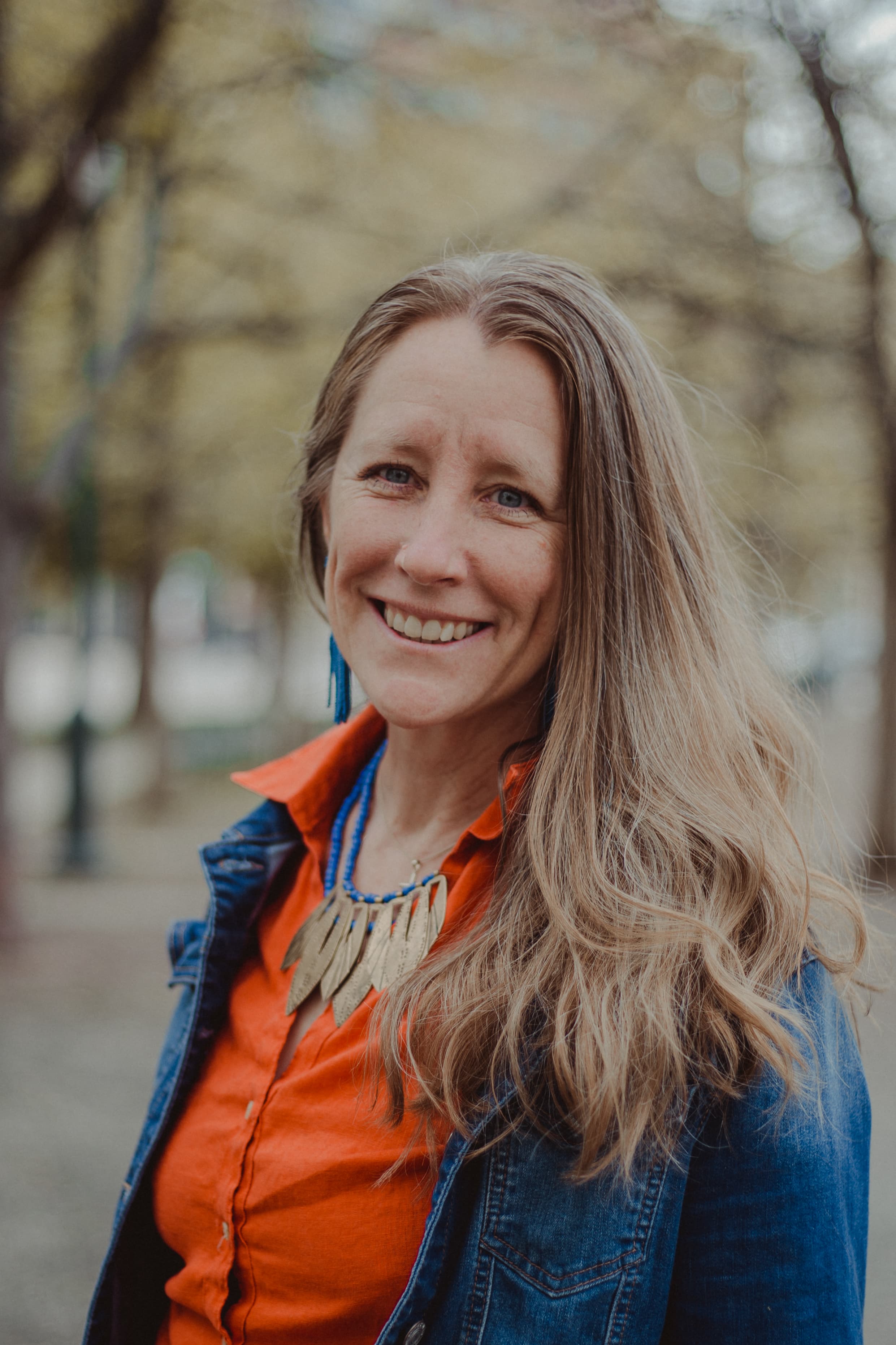 Heather Harbaugh smiling outdoors.